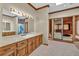 Bathroom with double vanity with view to hot tub room and natural lighting at 2701 East Mill Sw Way, Conyers, GA 30094