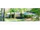 Traditional single-Gathering home with a manicured lawn, mature landscaping, and attached garage at 2701 East Mill Sw Way, Conyers, GA 30094