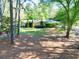 Ranch-style home featuring a well-manicured lawn and mature trees at 2701 East Mill Sw Way, Conyers, GA 30094