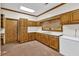Functional kitchenette featuring wood cabinets and countertop space at 2701 East Mill Sw Way, Conyers, GA 30094