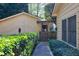 Charming walkway lined with manicured hedges, leading to a private entrance of the home at 2701 East Mill Sw Way, Conyers, GA 30094