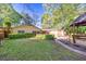 Lush backyard with pool, patio, pergola and house exterior at 2701 East Mill Sw Way, Conyers, GA 30094