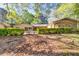 Spacious backyard featuring a covered patio and lush green landscaping for outdoor enjoyment at 2701 East Mill Sw Way, Conyers, GA 30094