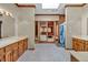 Bathroom with double sinks, skylight, and sauna access at 2701 East Mill Sw Way, Conyers, GA 30094