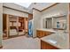 Spacious bathroom features a skylight, double sink vanity, and a doorway to a personal spa area at 2701 East Mill Sw Way, Conyers, GA 30094