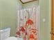 Bathroom featuring colorful mushroom themed shower curtain in front of the bathtub at 2701 East Mill Sw Way, Conyers, GA 30094