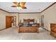 Bedroom with wooden furniture, fan, and neutral-colored walls at 2701 East Mill Sw Way, Conyers, GA 30094