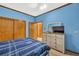 Bedroom with matching furniture and television on dresser at 2701 East Mill Sw Way, Conyers, GA 30094