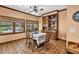 Charming dining room featuring tile flooring, a built-in cabinet, and multiple windows at 2701 East Mill Sw Way, Conyers, GA 30094
