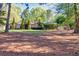 Well-maintained home exterior with mature trees, plants and lawn at 2701 East Mill Sw Way, Conyers, GA 30094