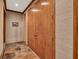 Entry foyer features double doors, stone flooring, and textured wallpaper at 2701 East Mill Sw Way, Conyers, GA 30094