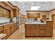 Bright and spacious kitchen featuring ample cabinetry, a central island, and a skylight at 2701 East Mill Sw Way, Conyers, GA 30094