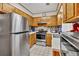 Functional kitchen with stainless steel appliances and classic wood cabinetry at 2701 East Mill Sw Way, Conyers, GA 30094