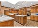 Expansive kitchen featuring custom cabinetry, an island, and ample counter space at 2701 East Mill Sw Way, Conyers, GA 30094