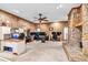 Spacious living room featuring a stone fireplace, wood trim, and carpeted floor at 2701 East Mill Sw Way, Conyers, GA 30094