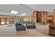 Bright living room with a cozy stone fireplace and large glass doors to the outdoor patio at 2701 East Mill Sw Way, Conyers, GA 30094