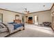 Spacious bedroom with ceiling fan, seating area, and natural light at 2701 East Mill Sw Way, Conyers, GA 30094