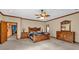 Bedroom featuring wooden furniture, ceiling fan, and neutral walls at 2701 East Mill Sw Way, Conyers, GA 30094
