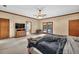 Bedroom with wooden furniture, ceiling fan, and access to outdoor area at 2701 East Mill Sw Way, Conyers, GA 30094