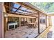 Covered outdoor patio with barbecue, dining table and chairs at 2701 East Mill Sw Way, Conyers, GA 30094