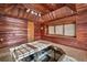 Home spa featuring wood clad walls and ceiling, tiled floors, and a large jacuzzi at 2701 East Mill Sw Way, Conyers, GA 30094