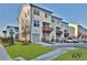Modern townhomes with attached garages and well-maintained landscaping at 3764 Sage Park Way, Suwanee, GA 30024