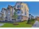Beautiful townhouse with brick and siding exterior and manicured lawn at 3764 Sage Park Way, Suwanee, GA 30024
