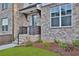 Charming front entrance with brick steps, landscaping, and a welcoming door at 3764 Sage Park Way, Suwanee, GA 30024