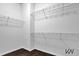 Walk-in closet with wire shelving and ample storage space at 3764 Sage Park Way, Suwanee, GA 30024