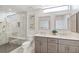Contemporary bathroom featuring dual sinks, quartz countertop and a glass-enclosed shower at 920 Memorial Se Dr # 44, Atlanta, GA 30316