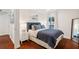 Cozy bedroom features a plush blue bed, soft lighting, and modern decor at 920 Memorial Se Dr # 44, Atlanta, GA 30316
