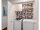 Chic laundry room showcasing a washer and dryer plus fun tiger print wallpaper at 920 Memorial Se Dr # 44, Atlanta, GA 30316