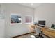 Bright home office features a modern desk, natural light from two windows, and contemporary decor at 920 Memorial Se Dr # 44, Atlanta, GA 30316