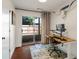 Stylish home office with a wooden desk, a sliding door, and unique decor at 920 Memorial Se Dr # 44, Atlanta, GA 30316