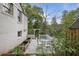 Private backyard patio area with dining set and manicured landscaping at 1794 Charline Ne Ave, Atlanta, GA 30306