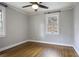 Bedroom with hardwood floors, ceiling fan, neutral walls, and natural light from windows at 1794 Charline Ne Ave, Atlanta, GA 30306