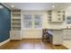 Open concept dining area with built-in bookshelves, breakfast bar, and kitchen views at 1794 Charline Ne Ave, Atlanta, GA 30306