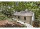 Exterior view of the house with a gray roof surrounded by trees at 1794 Charline Ne Ave, Atlanta, GA 30306