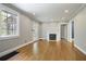 Bright and airy living room with hardwood floors, large windows, a fireplace, and neutral paint at 1794 Charline Ne Ave, Atlanta, GA 30306