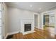 Inviting living room featuring hardwood floors, modern fireplace, neutral paint, and an open floor plan at 1794 Charline Ne Ave, Atlanta, GA 30306