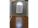 Vaulted bedroom offers large arched window and ceiling fan at 2250 Camp Town Way, Lawrenceville, GA 30044