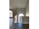 Bright entryway with dark wood floors, leading to the front door under a modern chandelier at 2250 Camp Town Way, Lawrenceville, GA 30044