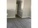 Hallway with updated floors, neutral paint, and white trim work at 2250 Camp Town Way, Lawrenceville, GA 30044