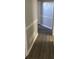 Hallway with fresh paint and decorative molding features hard wood floors at 2250 Camp Town Way, Lawrenceville, GA 30044