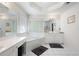 Spa-like bathroom featuring a soaking tub, separate vanities, and abundant natural light at 3225 Warren Creek Sw Dr, Hiram, GA 30141