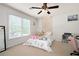 Bright and airy bedroom with a large window and neutral decor at 3225 Warren Creek Sw Dr, Hiram, GA 30141