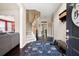 Inviting foyer with hardwood floors, staircase, and a view into the adjacent rooms at 3225 Warren Creek Sw Dr, Hiram, GA 30141