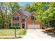 Charming two-story brick home with a well-manicured lawn, mailbox, and attached two car garage at 3225 Warren Creek Sw Dr, Hiram, GA 30141