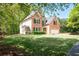 Charming two-story brick home with a well-manicured lawn, and attached two car garage at 3225 Warren Creek Sw Dr, Hiram, GA 30141