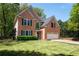 Charming two-story brick home with a well-manicured lawn, and attached two car garage at 3225 Warren Creek Sw Dr, Hiram, GA 30141